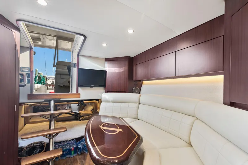 Slide: The Image of Luxurious interior of 2017 Jupiter 41SB yacht with white leather seating and wooden accents. - 10