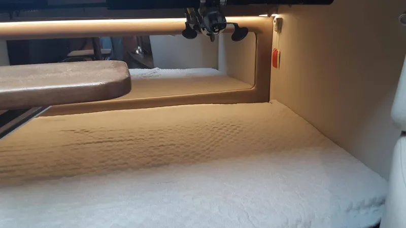 Slide: The Image of 2017 Jupiter 41SB cabin interior with bed and table. - 21