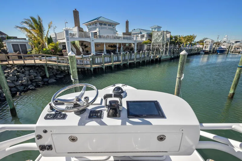Slide: The Image of Jupiter 41SB 2017 boat helm with waterfront view and docked houses. - 4
