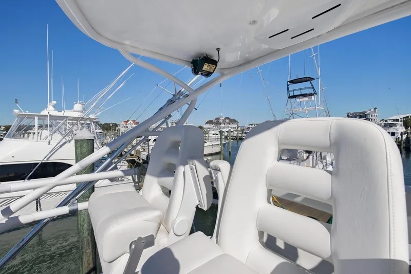 Slide: The Image of 2017 Jupiter 41SB boat with white seating at a marina. - 5