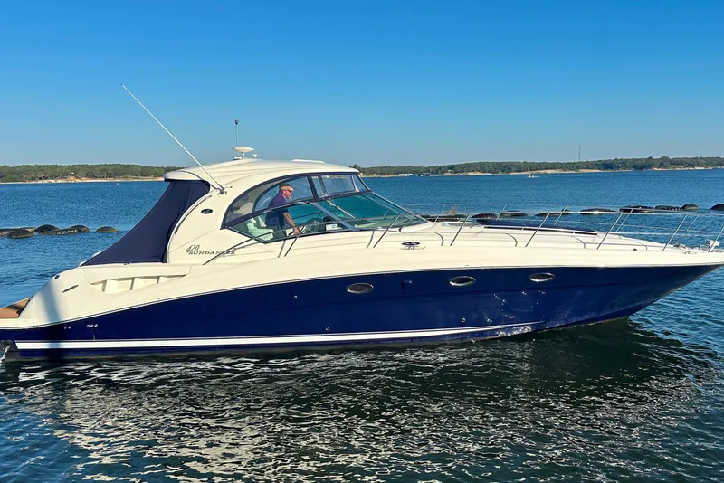Slide: The Image of 2004 Sea Ray 420 Sundancer yacht cruising on a sunny day. - 10