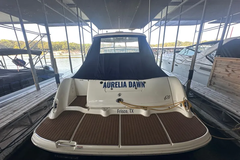 Slide: The Image of 2004 Sea Ray 420 Sundancer docked, rear view with "Aurelia Dawn" name, Frisco, TX. - 20