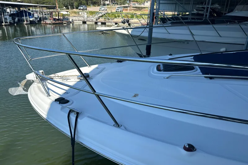 Slide: The Image of 2004 Sea Ray 420 Sundancer yacht docked at marina, featuring sleek white deck design. - 23