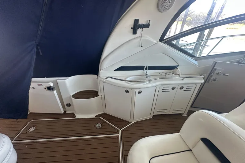 Slide: The Image of Interior of 2004 Sea Ray 420 Sundancer yacht with sleek cabinetry and seating. - 42