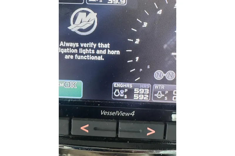 Slide: The Image of Display screen of 2004 Sea Ray 420 Sundancer showing engine hours and system check. - 43