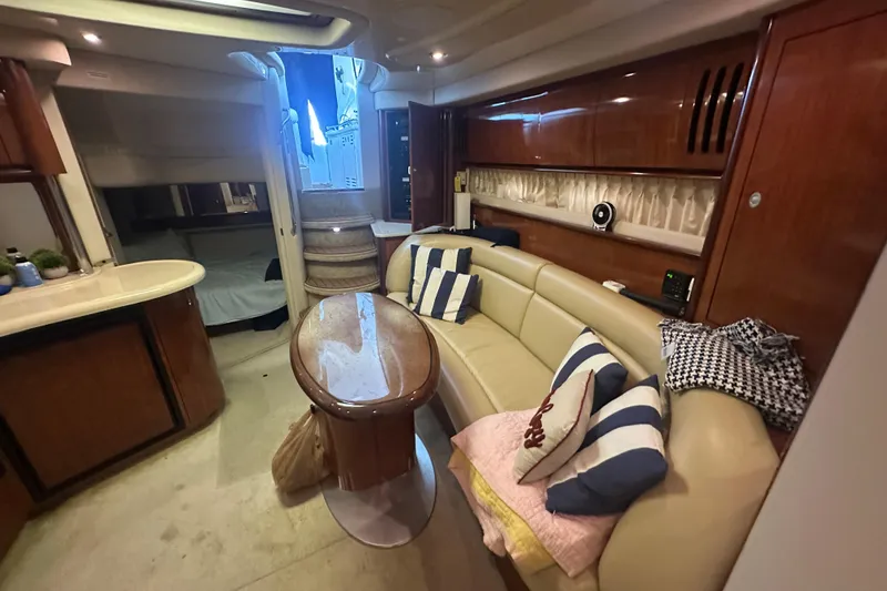 Slide: The Image of Luxurious interior of a 2004 Sea Ray 420 Sundancer yacht with elegant seating and decor. - 58