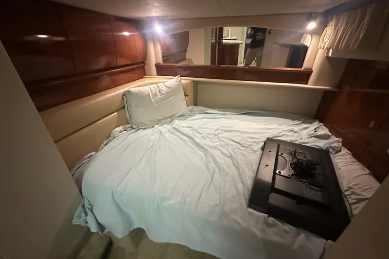Slide: The Image of Interior cabin of 2004 Sea Ray 420 Sundancer with bed and TV. - 60