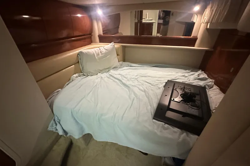 Slide: The Image of Interior cabin of 2004 Sea Ray 420 Sundancer with bed and TV. - 61