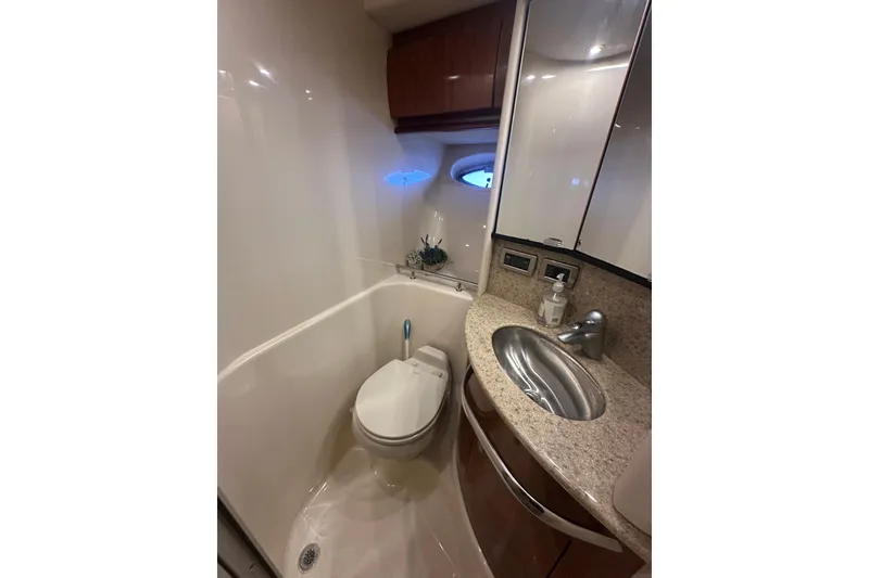 Slide: The Image of Luxurious bathroom in 2004 Sea Ray 420 Sundancer yacht with modern fixtures. - 64