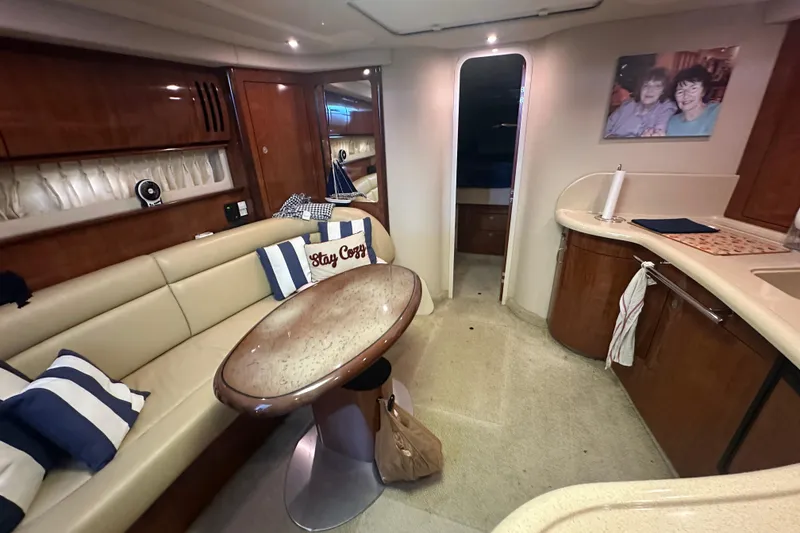 Slide: The Image of Interior of 2004 Sea Ray 420 Sundancer yacht with cozy seating and elegant decor. - 66