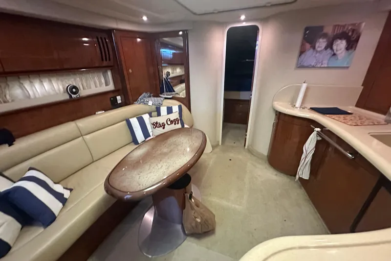 Slide: The Image of Interior of 2004 Sea Ray 420 Sundancer yacht with cozy seating and elegant decor. - 67