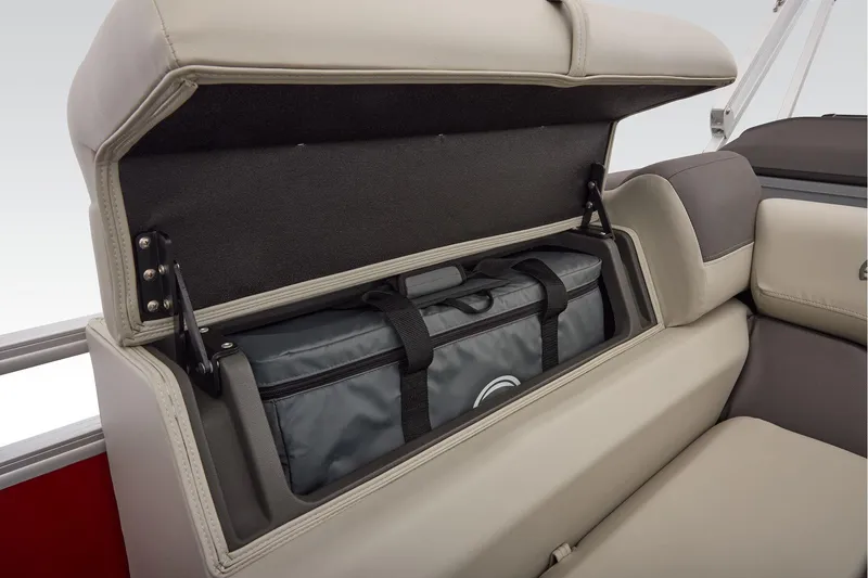 Slide: The Image of Manufacturer Provided Image: 2026 Sun Tracker Fishin' Barge 22 DLX storage compartment with cushioned seating. - 54