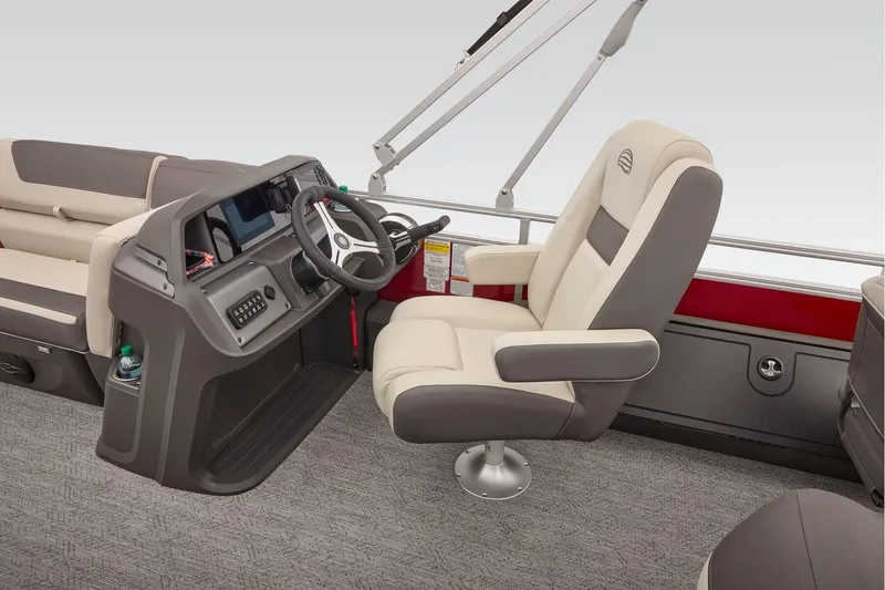 Slide: The Image of Manufacturer Provided Image: 2026 Sun Tracker Fishin' Barge 22 DLX interior with steering console and seating. - 57