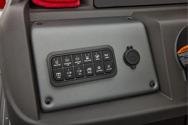 Slide: The Image of Manufacturer Provided Image: Control panel of 2026 Sun Tracker Fishin' Barge 22 DLX with various function buttons. - 62