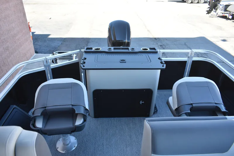 Slide: The Image of 2026 Sun Tracker Fishin' Barge 22 DLX interior with seating and control panel. - 9