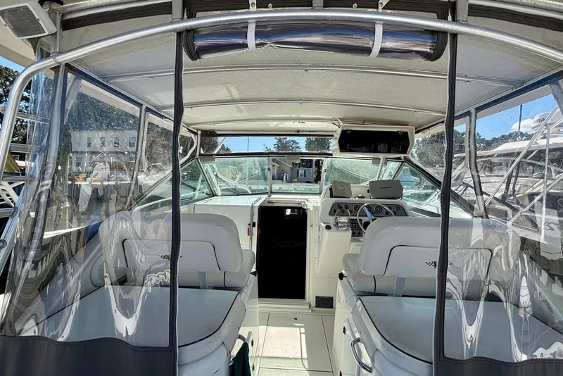 Slide: The Image of Interior view of 2002 Wellcraft 330 Coastal boat with helm and seating area. - 2