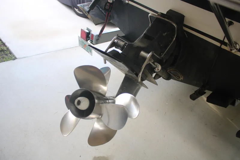 Slide: The Image of 2011 Larson Carbiro 240 boat propeller and outdrive detail. - 11