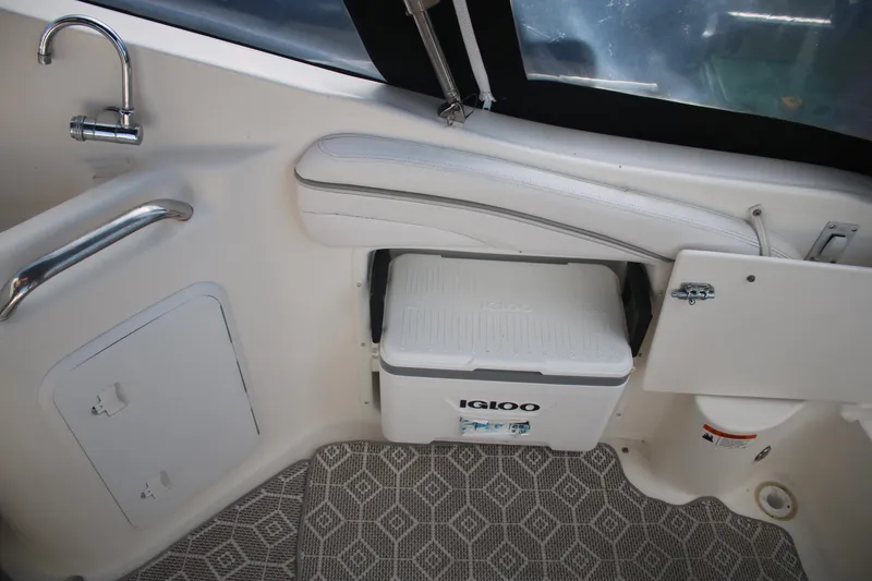 Slide: The Image of Interior of 2011 Larson Carbiro 240 boat with Igloo cooler and seating area. - 17