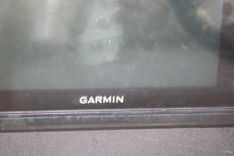Slide: The Image of Garmin display screen on 2011 Larson Carbiro 240 boat dashboard. - 26