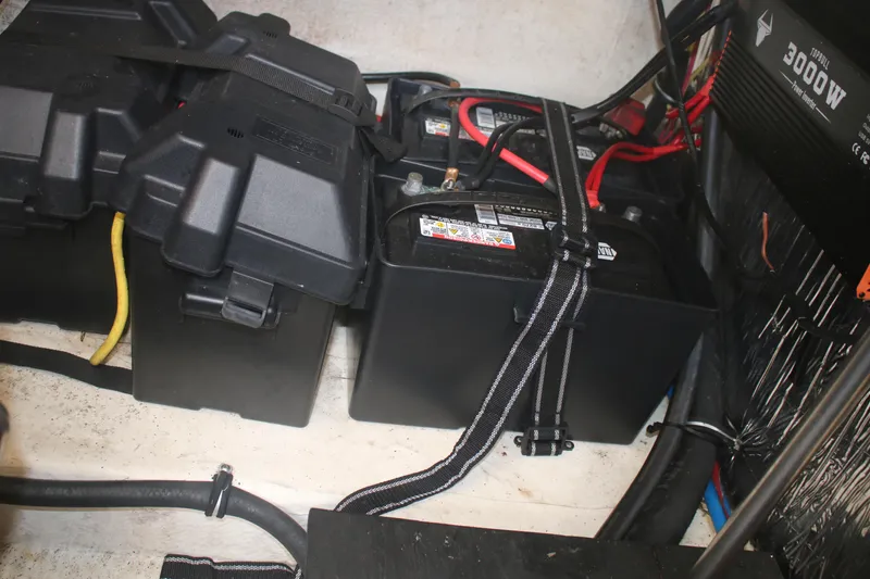 Slide: The Image of Battery compartment of a 2011 Larson Carbiro 240 boat with power inverter. - 8