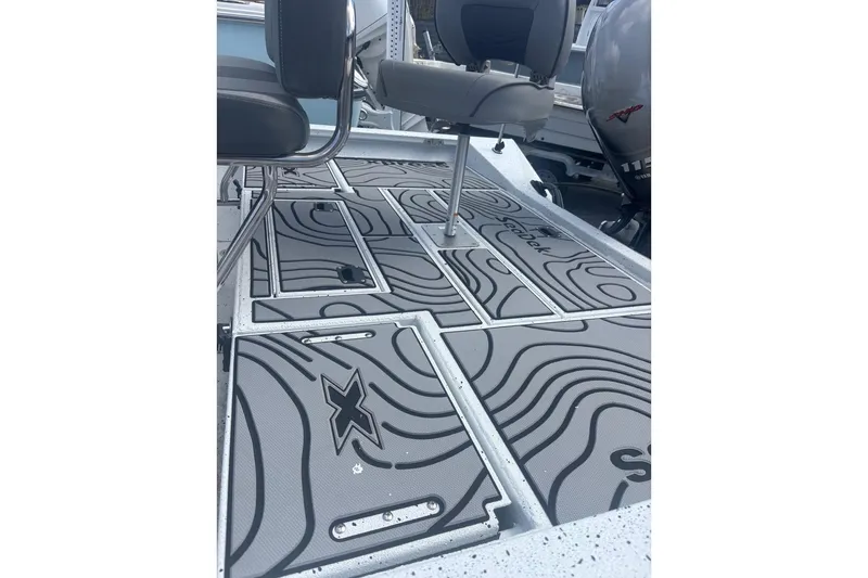 Slide: The Image of 2024 Xpress H20B Bay boat deck with stylish SeaDek flooring and seating. - 5