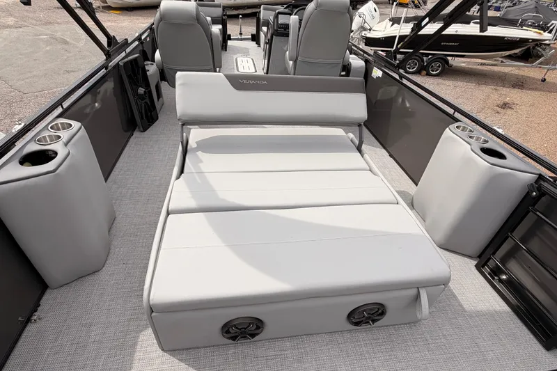 Slide: The Image of 2026 Veranda VR 265 VLI boat interior with gray seating and cup holders. - 17