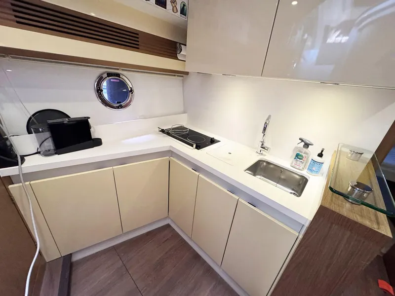 Slide: The Image of Modern kitchen in 2015 Beneteau Gran Turismo 44 yacht with sleek cabinetry and appliances. - 6