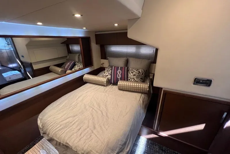 Slide: The Image of Luxurious kitchen interior of 2013 Sea Ray 540 Sundancer yacht with modern wood cabinetry. - 19