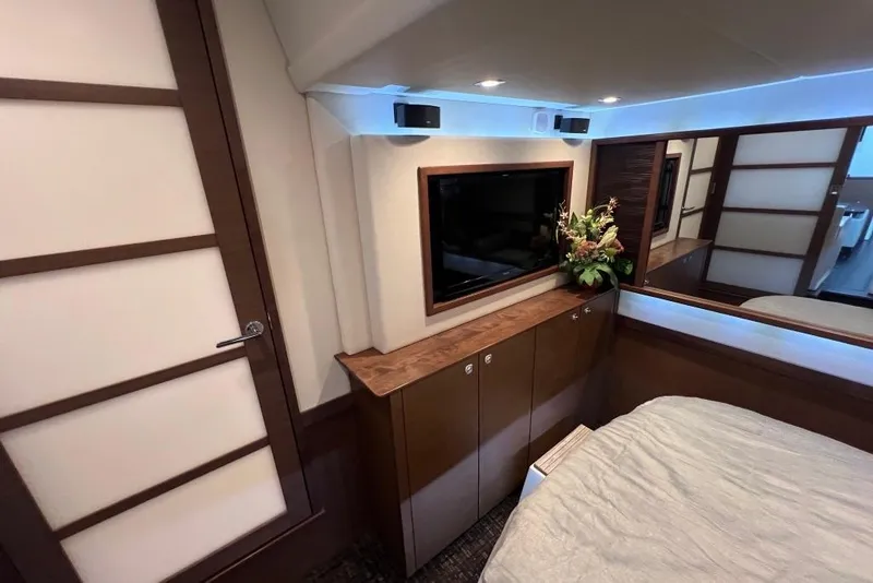 Slide: The Image of Luxurious interior of 2013 Sea Ray 540 Sundancer yacht bedroom with modern design. - 20