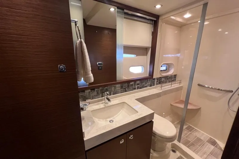 Slide: The Image of Luxurious bedroom interior of 2013 Sea Ray 540 Sundancer yacht with elegant bedding. - 22