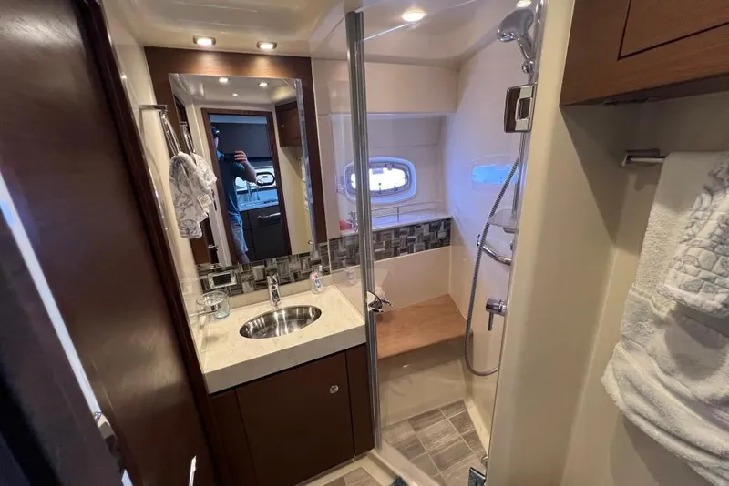 Slide: The Image of Luxurious bathroom interior of 2013 Sea Ray 540 Sundancer yacht with wooden cabinetry. - 28