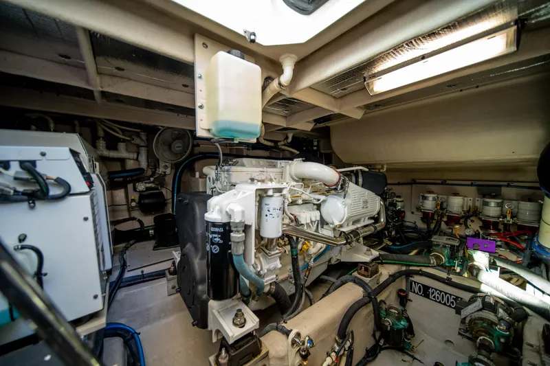 Slide: The Image of Engine room of 2013 Sea Ray 540 Sundancer yacht, showcasing mechanical components and systems. - 31