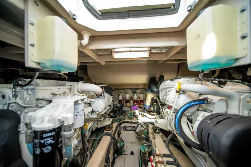 Slide: The Image of Engine room of 2013 Sea Ray 540 Sundancer yacht, showcasing mechanical components and systems. - 32