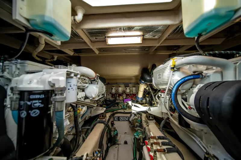 Slide: The Image of Engine room of 2013 Sea Ray 540 Sundancer yacht, showcasing mechanical components and systems. - 33