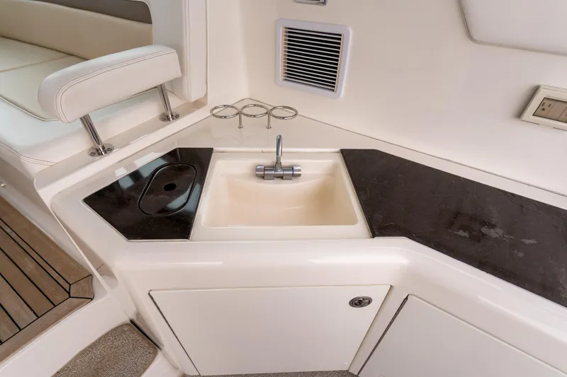 Slide: The Image of Luxurious 2013 Sea Ray 540 Sundancer yacht interior with sleek kitchenette and sink. - 41