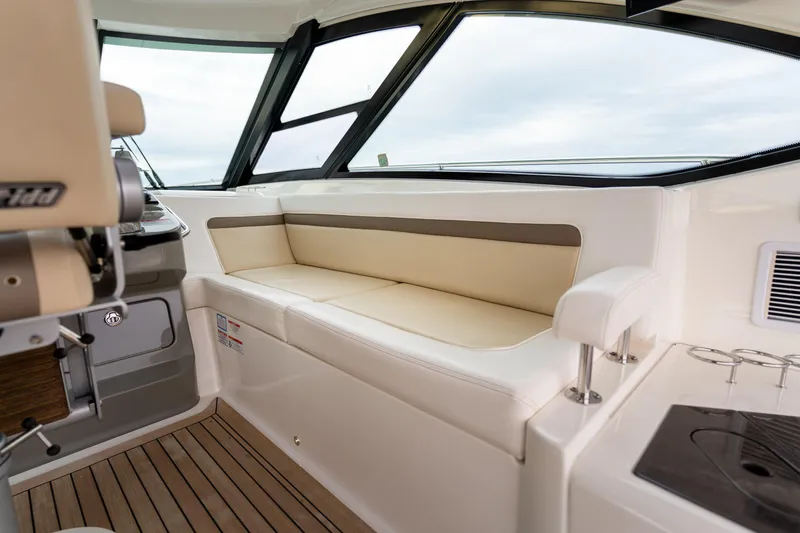 Slide: The Image of Luxurious interior of 2013 Sea Ray 540 Sundancer yacht with beige seating and sleek design. - 42