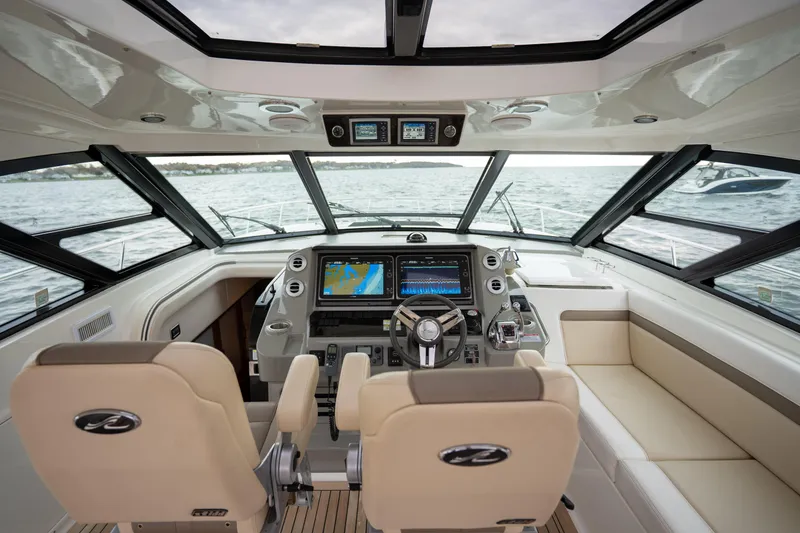 Slide: The Image of Interior view of 2013 Sea Ray 540 Sundancer yacht cockpit with navigation screens. - 47