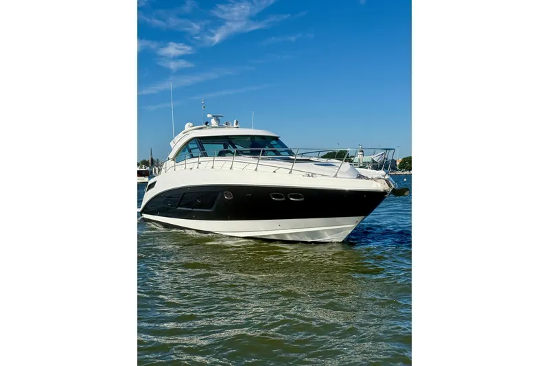 Slide: The Image of 2013 Sea Ray 540 Sundancer yacht cruising swiftly on open water. - 5