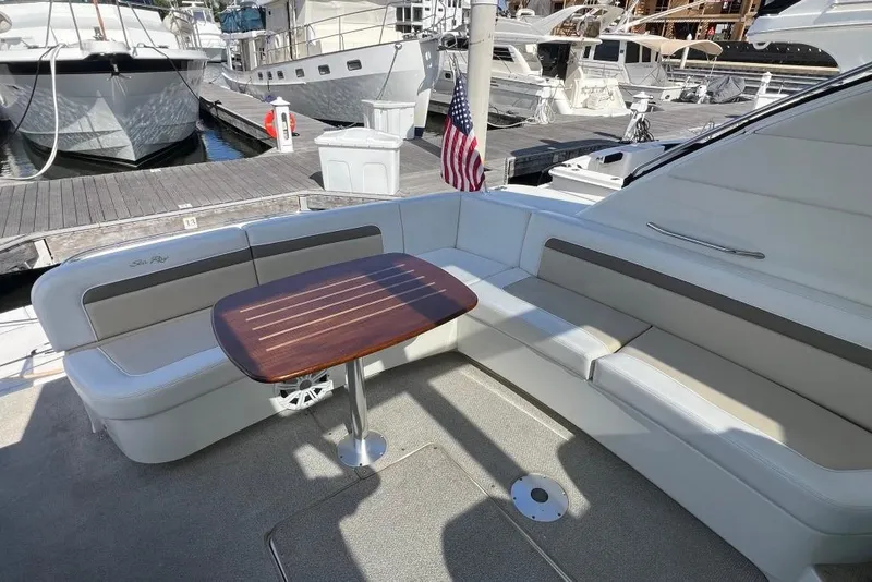 Slide: The Image of 2013 Sea Ray 540 Sundancer yacht cruising near a large suspension bridge. - 7
