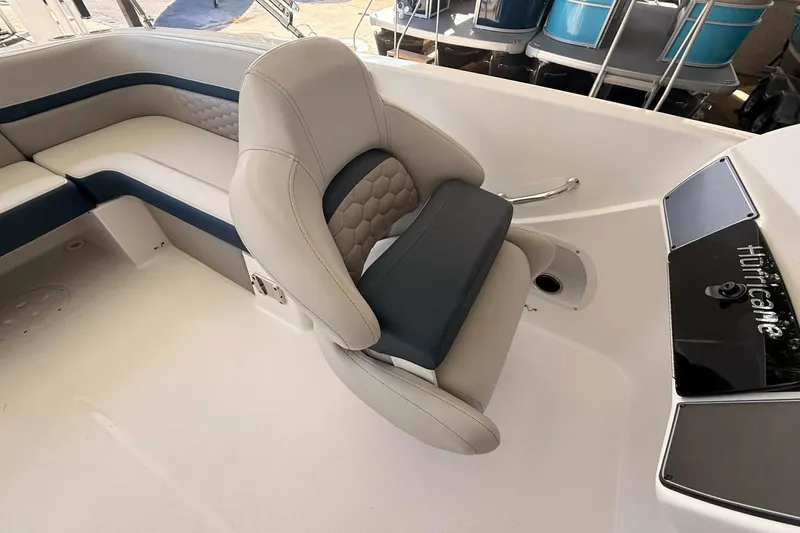 Slide: The Image of 2026 Hurricane Sundeck Sport 218 OB boat interior with cushioned seating and sleek design. - 10