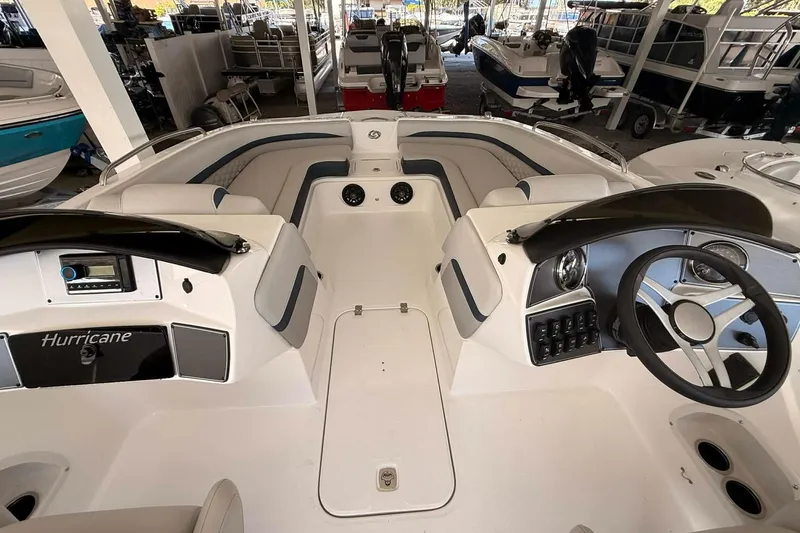 Slide: The Image of 2026 Hurricane Sundeck Sport 218 OB interior, featuring sleek design and modern controls. - 7