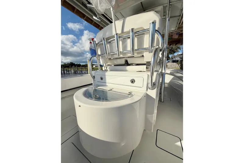Slide: The Image of 2023 Contender 30 Tournament boat interior with fishing rod holders and storage. - 14
