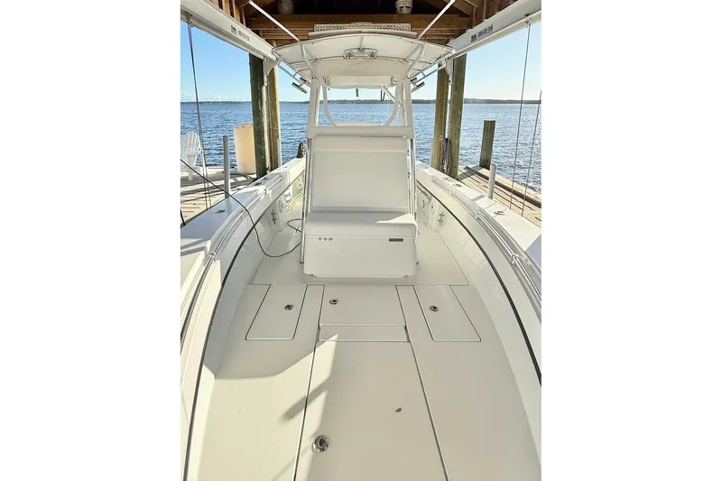 Slide: The Image of 2023 Contender 30 Tournament boat interior, docked by the water. - 18