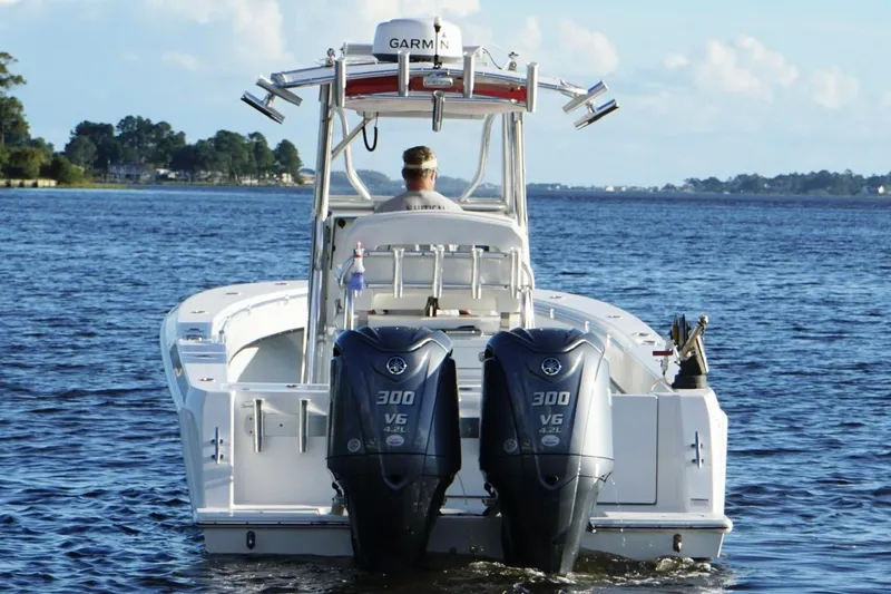 Slide: The Image of 2023 Contender 30 Tournament boat with dual Yamaha 300 V6 engines on open water. - 4