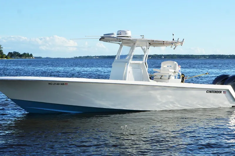 Slide: The Image of 2023 Contender 30 Tournament boat on calm water, clear sky background. - 9