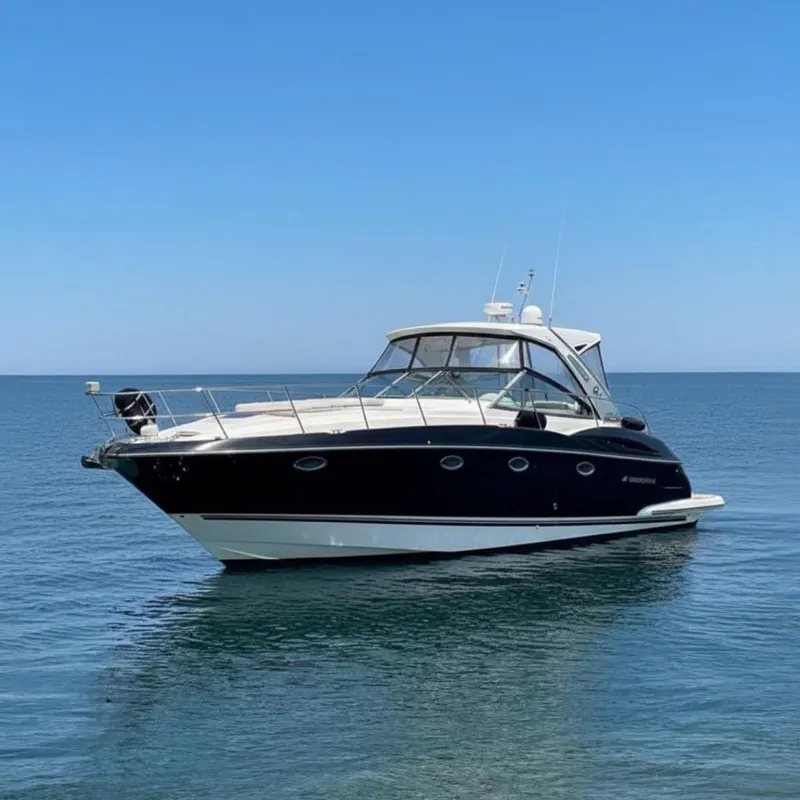 The Image of 2013 Monterey 400 Sport Yacht on calm blue water under clear sky. - 0