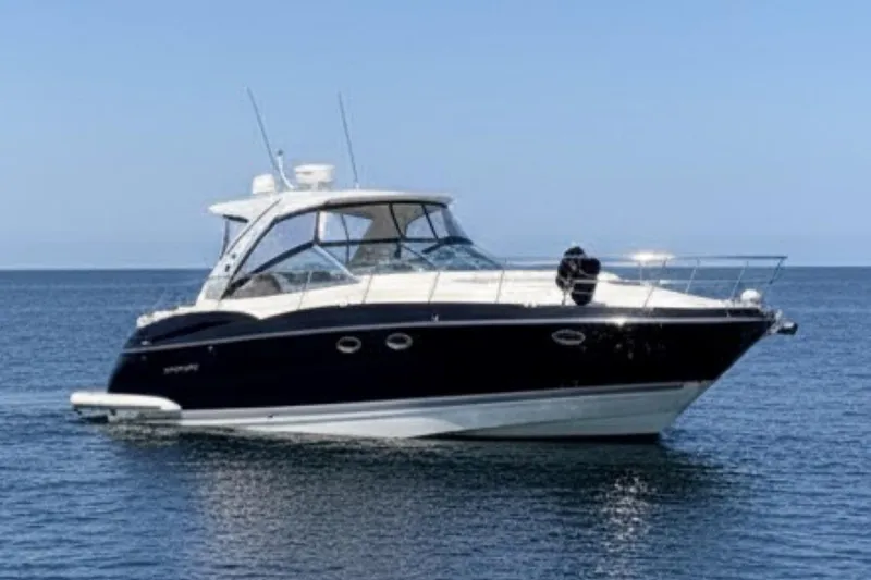 Slide: The Image of 2013 Monterey 400 Sport Yacht on calm blue water, side view. - 1