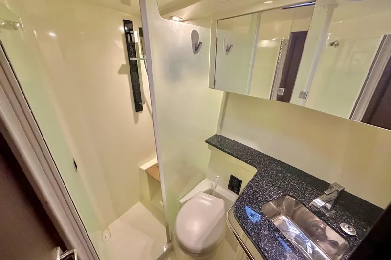 Slide: The Image of Luxurious bathroom in 2013 Monterey 400 Sport Yacht with modern fixtures and sleek design. - 11