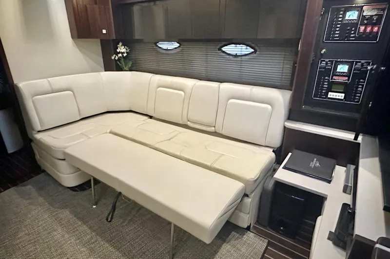 Slide: The Image of Luxurious interior of 2013 Monterey 400 Sport Yacht with cream leather seating and control panels. - 18