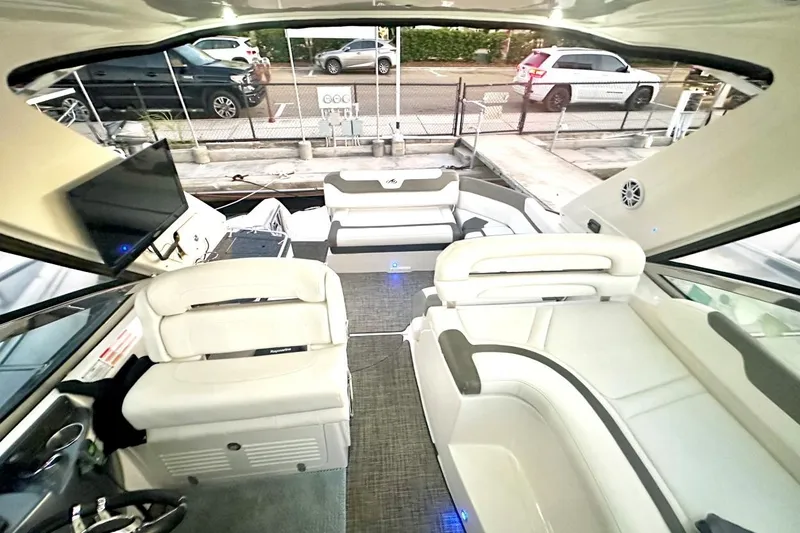 Slide: The Image of Interior of a 2013 Monterey 400 Sport Yacht with luxurious seating and modern amenities. - 2